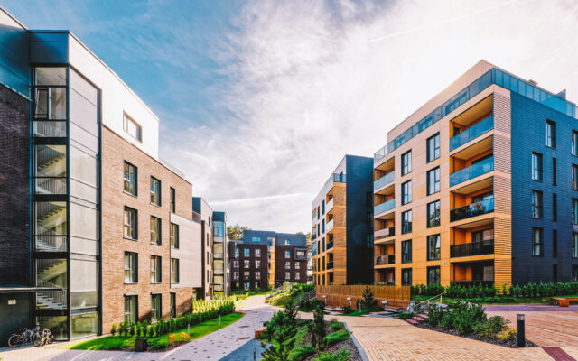 A modern complex of apartment buildings. And outdoor facilities. Mixed media.