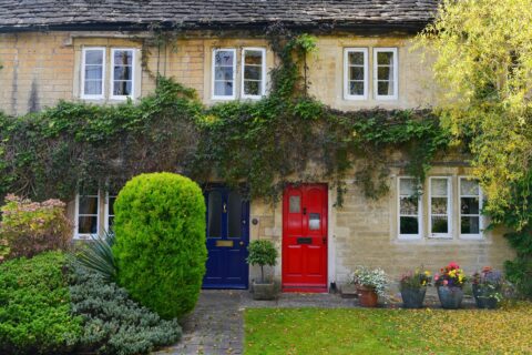 Two adjacent cottages sharing a boundary, , suggesting possible shared septic tank disputes.