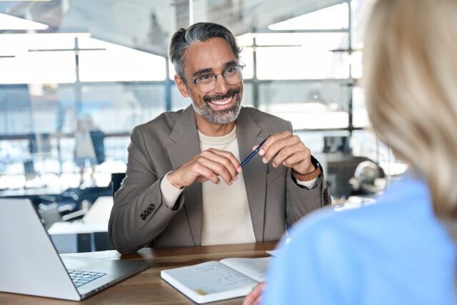 Financial advisor reviewing documents with client to strengthen mis-selling claim