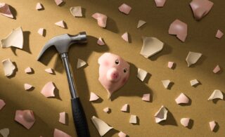 Broken piggy bank spilling coins, symbolising annuity mis-selling loss.