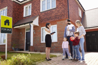 Outside of a Newly Built House For Sale With Young Family