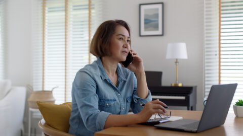 Person collecting evidence and reporting online banking scam to their bank and Action Fraud.