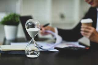 Clock and documents symbolising EEA Life Settlements fund claims.