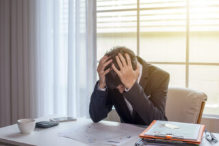 Distressed investor symbolising NPI pension losses.