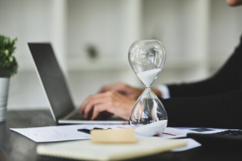 Hourglass on legal documents symbolising time limits for surveyor negligence claims