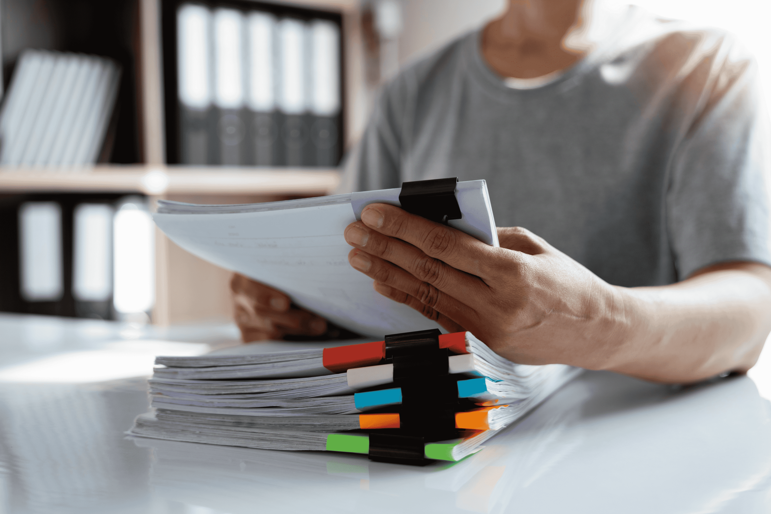 An individual reviewing financial paperwork with confidence, illustrating clear signs of a strong financial adviser negligence claim.