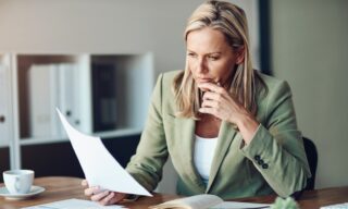 Person reviewing financial documents to assess investment mis-selling claim time limits
