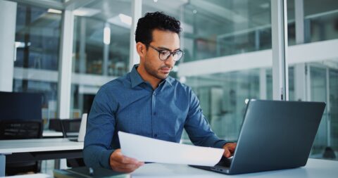 Solicitor reviewing financial documents and evidence for a crypto scam recovery claim