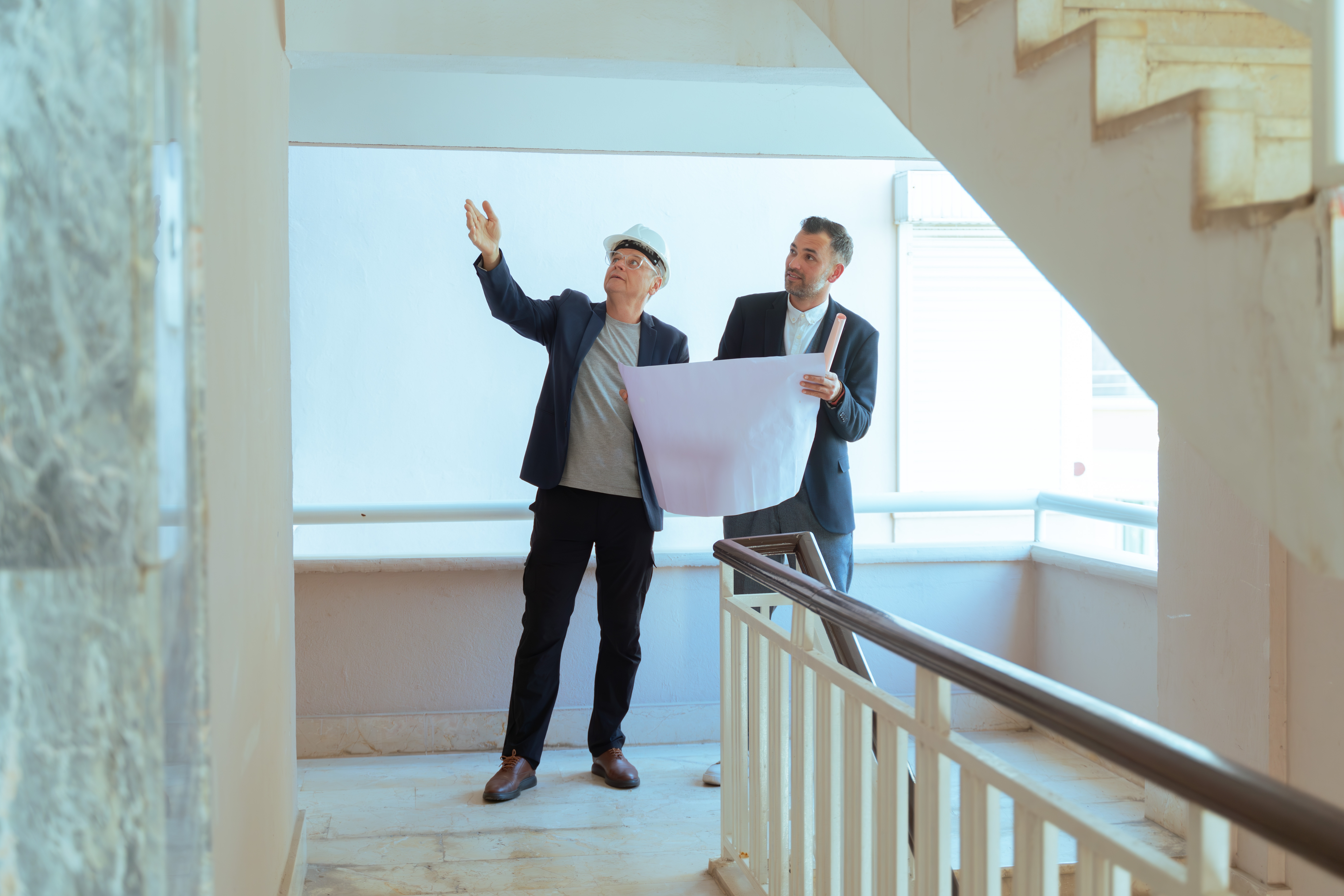 Architect inspecting a property while assessing construction defects that may result in a professional negligence claim.
