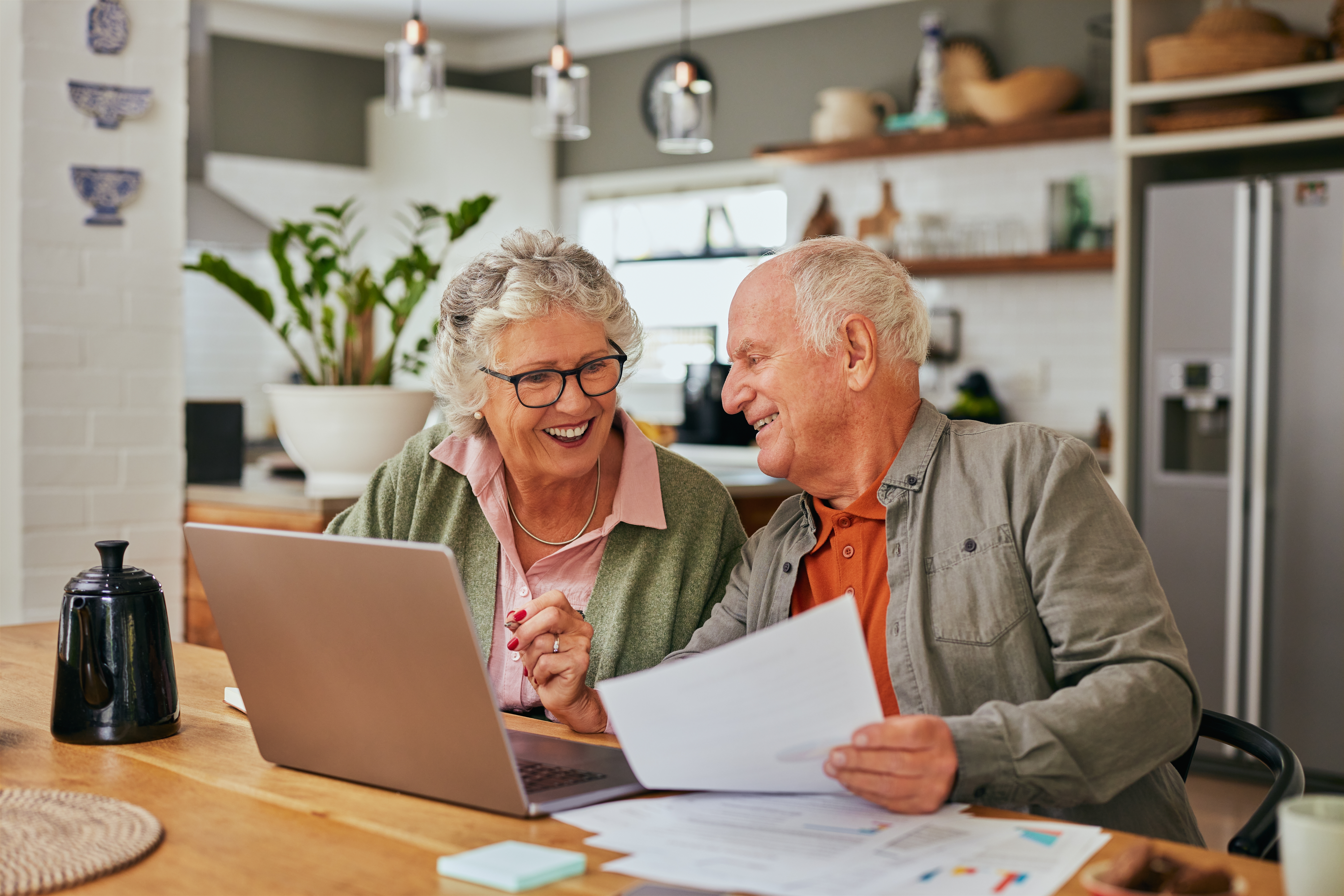 Mature couple reviewing their retirement finances together at home