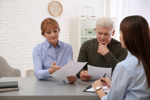 Solicitor reviewing financial documents for a potential claim
