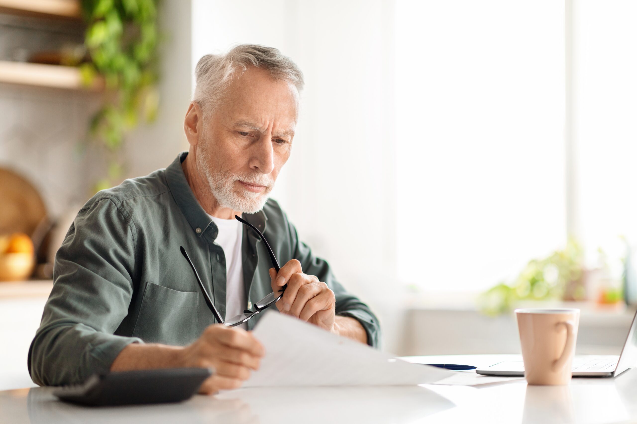 Person reviewing pension documents and important dates