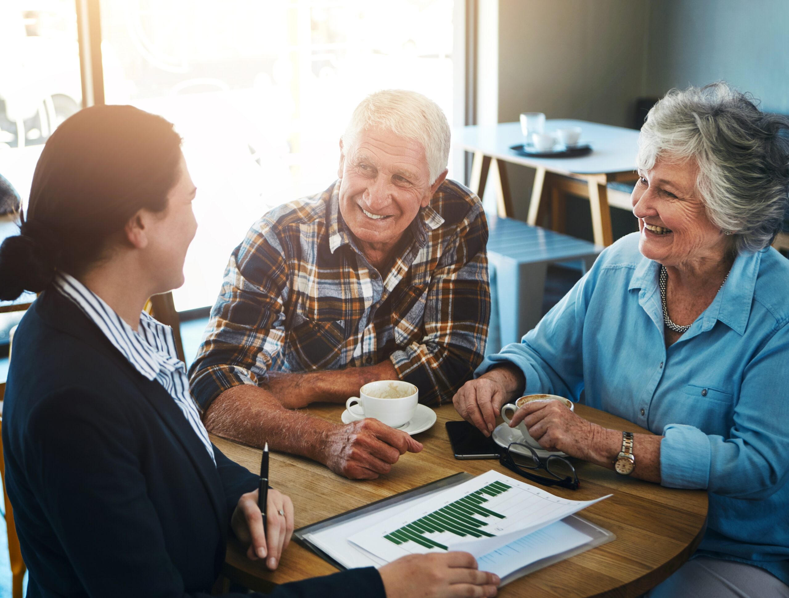 Financial adviser discussing investment performance with older clients